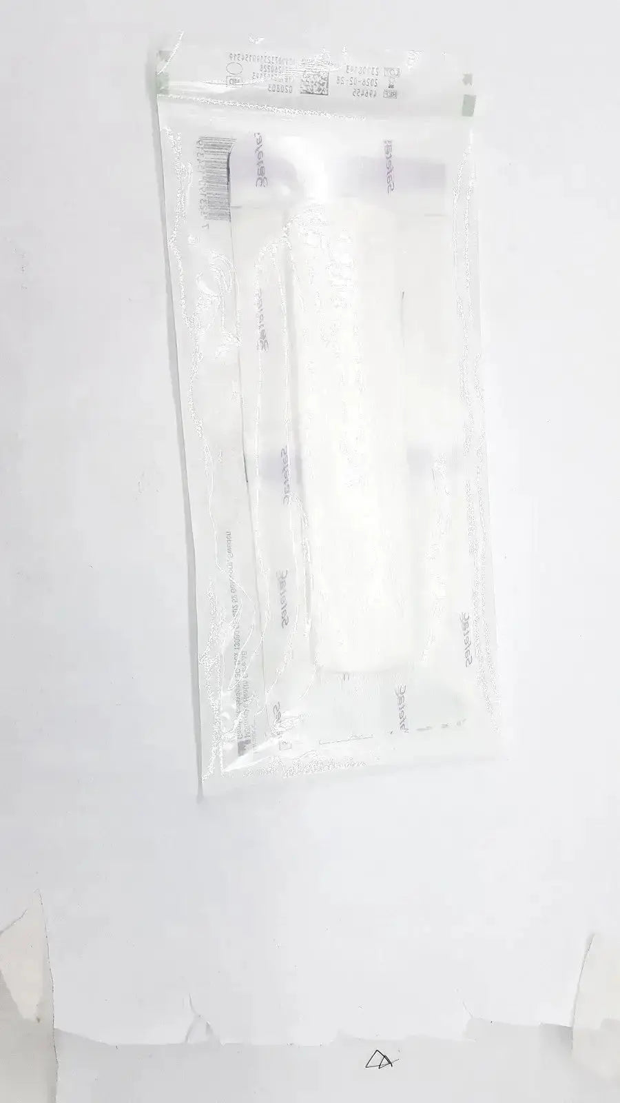 A clear plastic pouch containing sterile white cotton swab and syringes for mepliex border post-op 4 x 12 inches