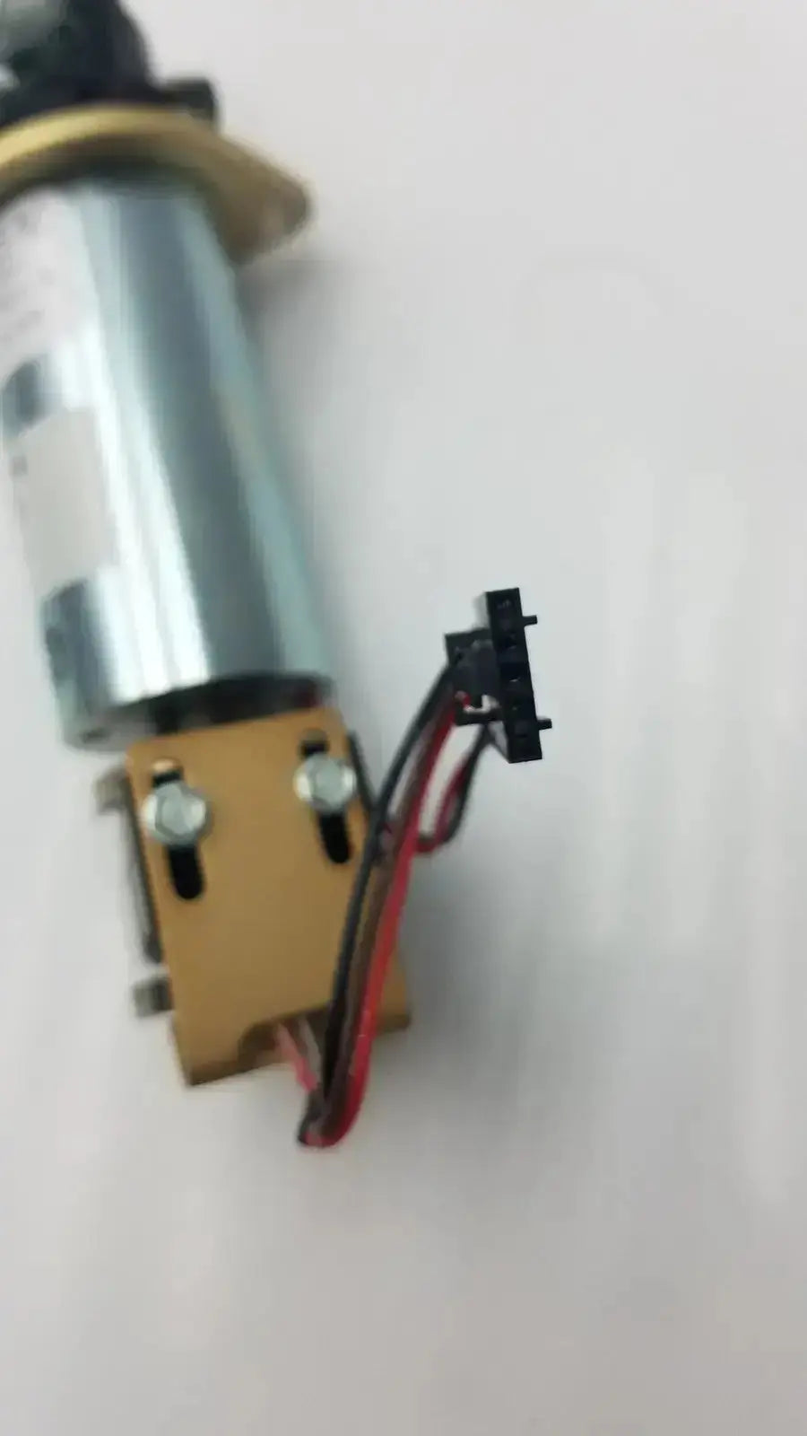 Silver cylindrical motor with gold mounting bracket and black connector for acro associates 955v8669 rev a valve