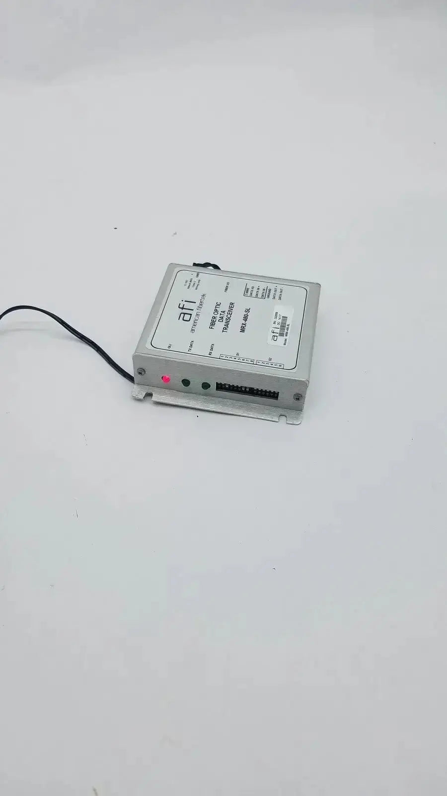 Silver metal american fibertek mrx-480-sl optic data transceiver with black cable labeled afi on front panel