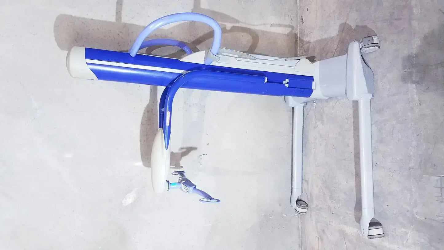 Arjo maxi power patient lift in blue and white with adjustable armrests and wheels for safe patient handling