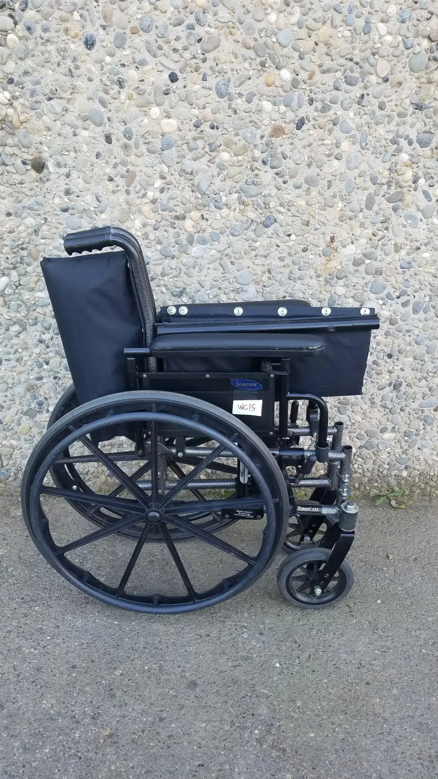 Black Invacare Tracer SX5 Wheelchair Featuring Sturdy Arm Rests