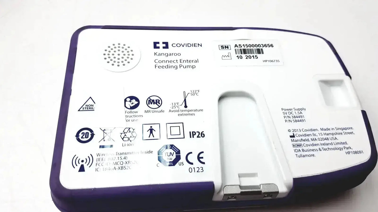 Purple and white covidien kangroo feeding pump with connect pole clamp and extras for enteral feeding use