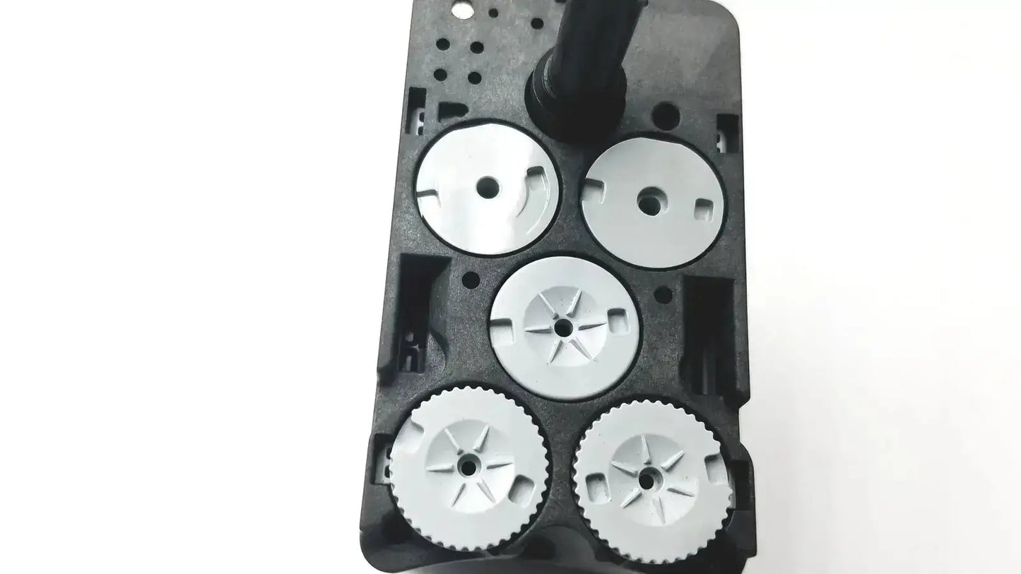 Black plastic housing with five silver metal gears including a star pattern on da vinci xi 471205 fenestrated bipolar forceps 8mm
