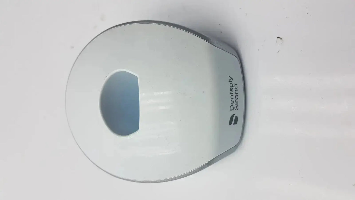 White plastic dentsply sirona smartlite focus curing light charger base with sleek rounded design and logo printed on side