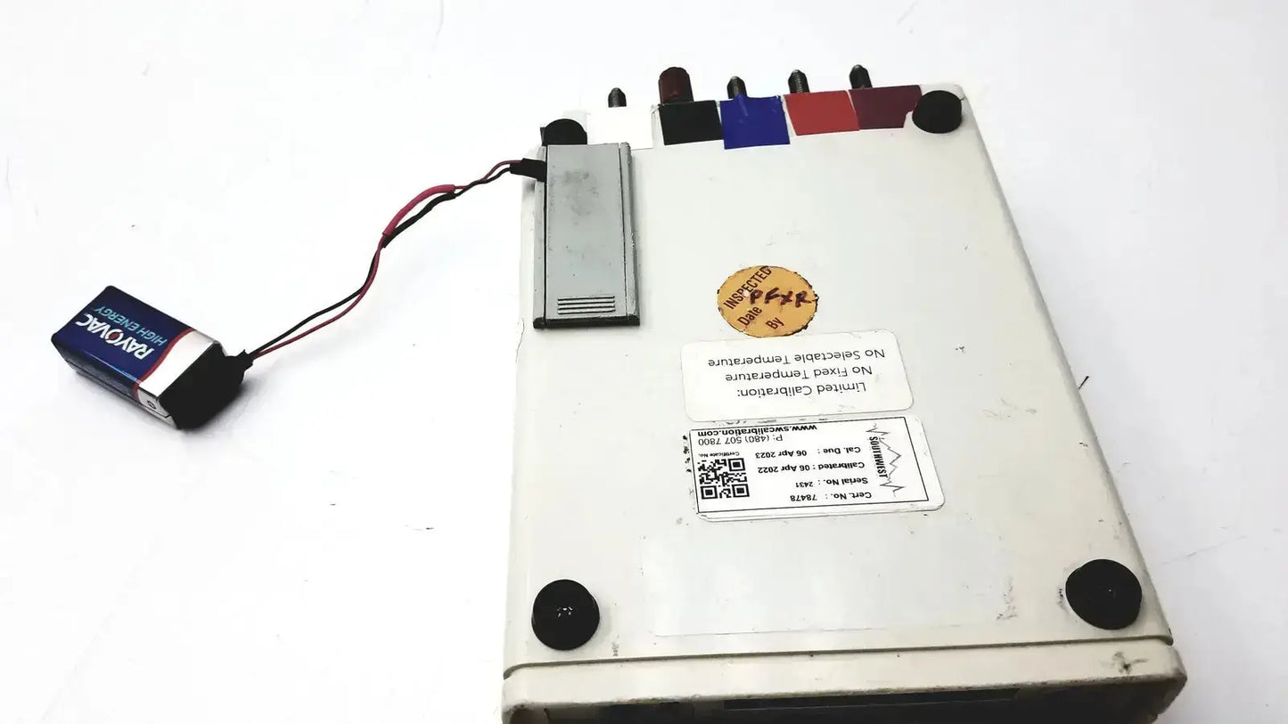 White rectangular dynatech nevada 215a portable lightweight respiratory patient simulator with colored input ports and silver battery pack