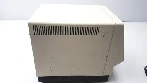Beige plastic esa 5200a detector with black base and vertical ventilation slits on the back side of the device