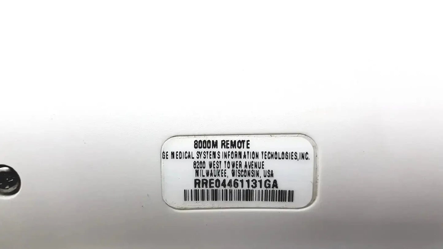 White plastic label with black text and barcode on the back of a ge adult solar 8000m remote control device