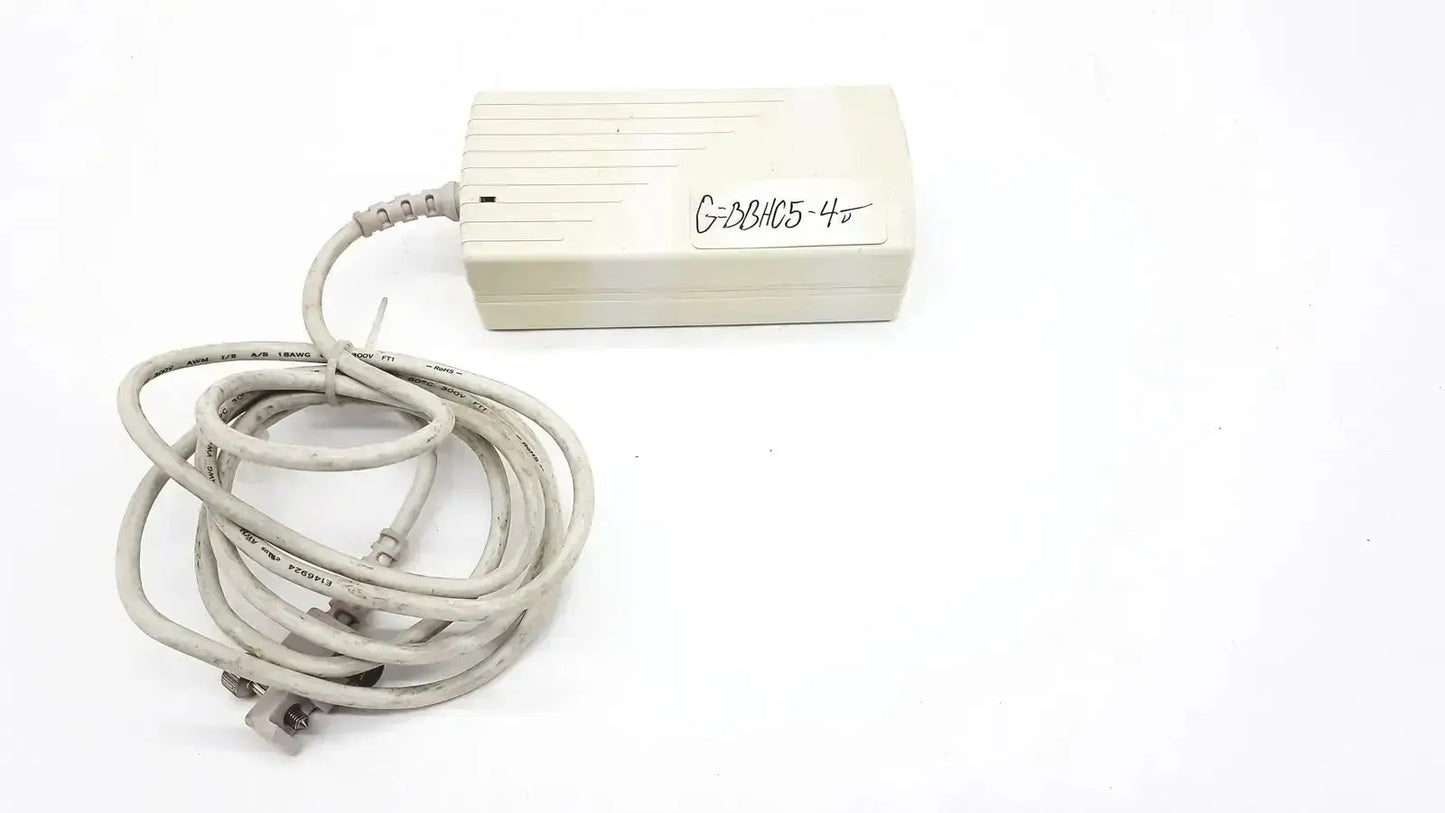 Beige rectangular spacelabs snp-a085-3y power adapter with coiled gray cable used medical equipment for sale
