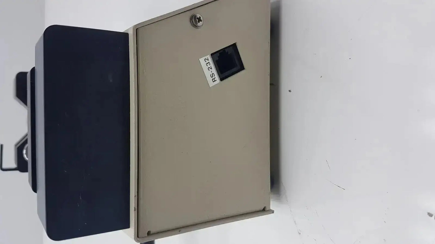 Beige metal enclosure of harvard apparatus model 11 digital single syringe pump with black rs-232 ethernet port and silver screw top