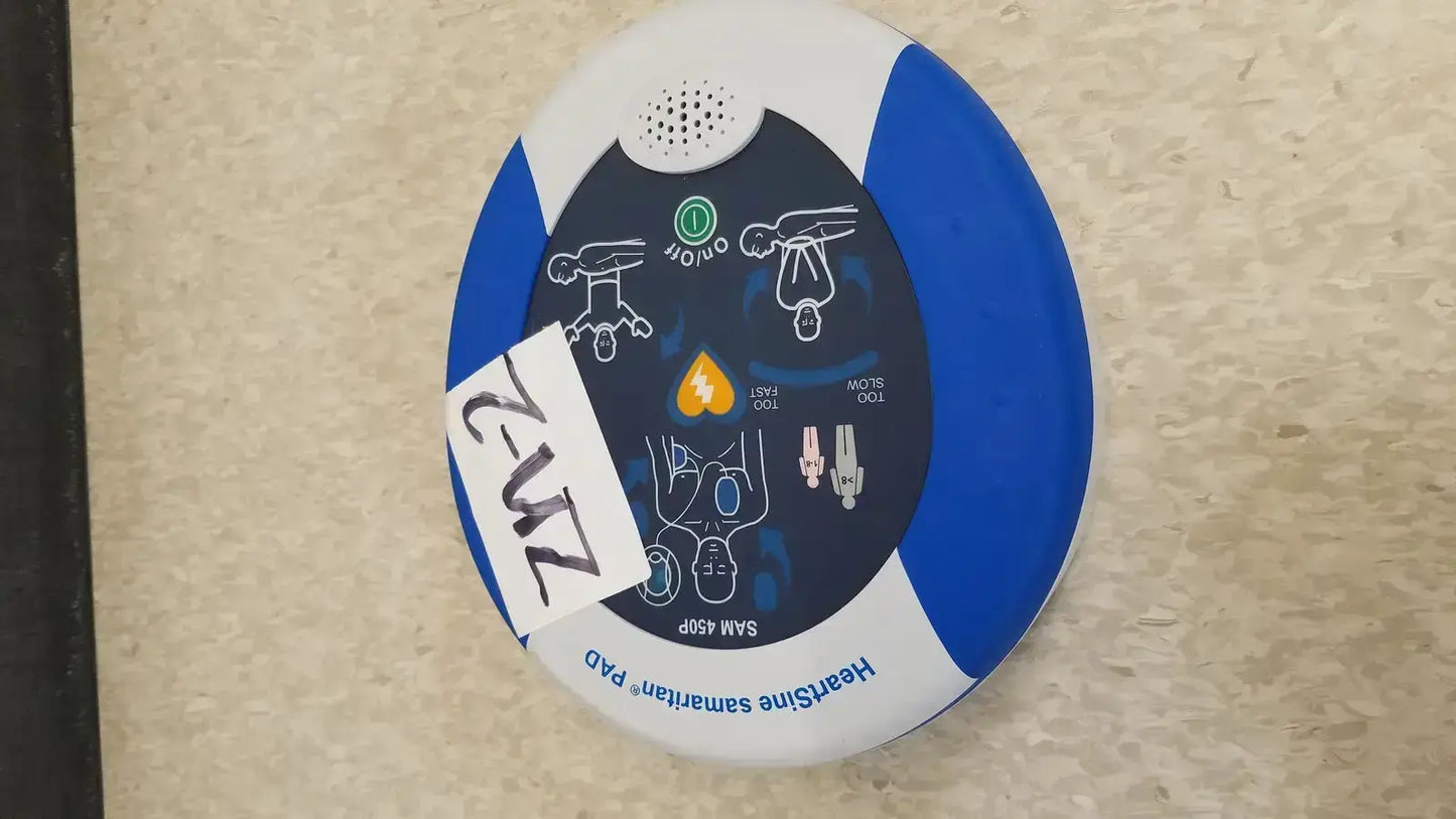 Blue and white oval-shaped automated external defibrillator heartsine samaritan pad 450p with instructional diagrams