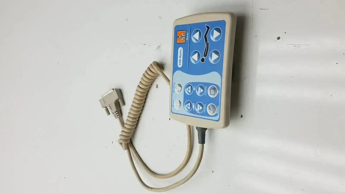 Beige and blue Hill-Rom patient hand control with coiled cable and d-sub connector for medical-grade bed use