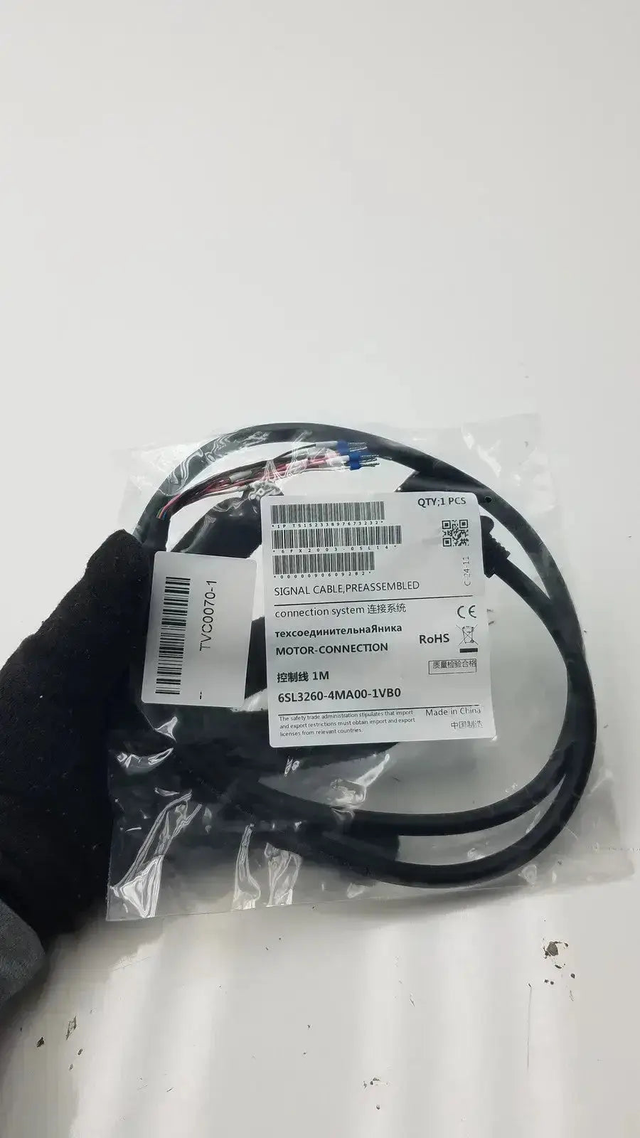 Black coiled signal cable with white label for preassembled motor connection im signal cable 6sl3260-4ma00-1vb0