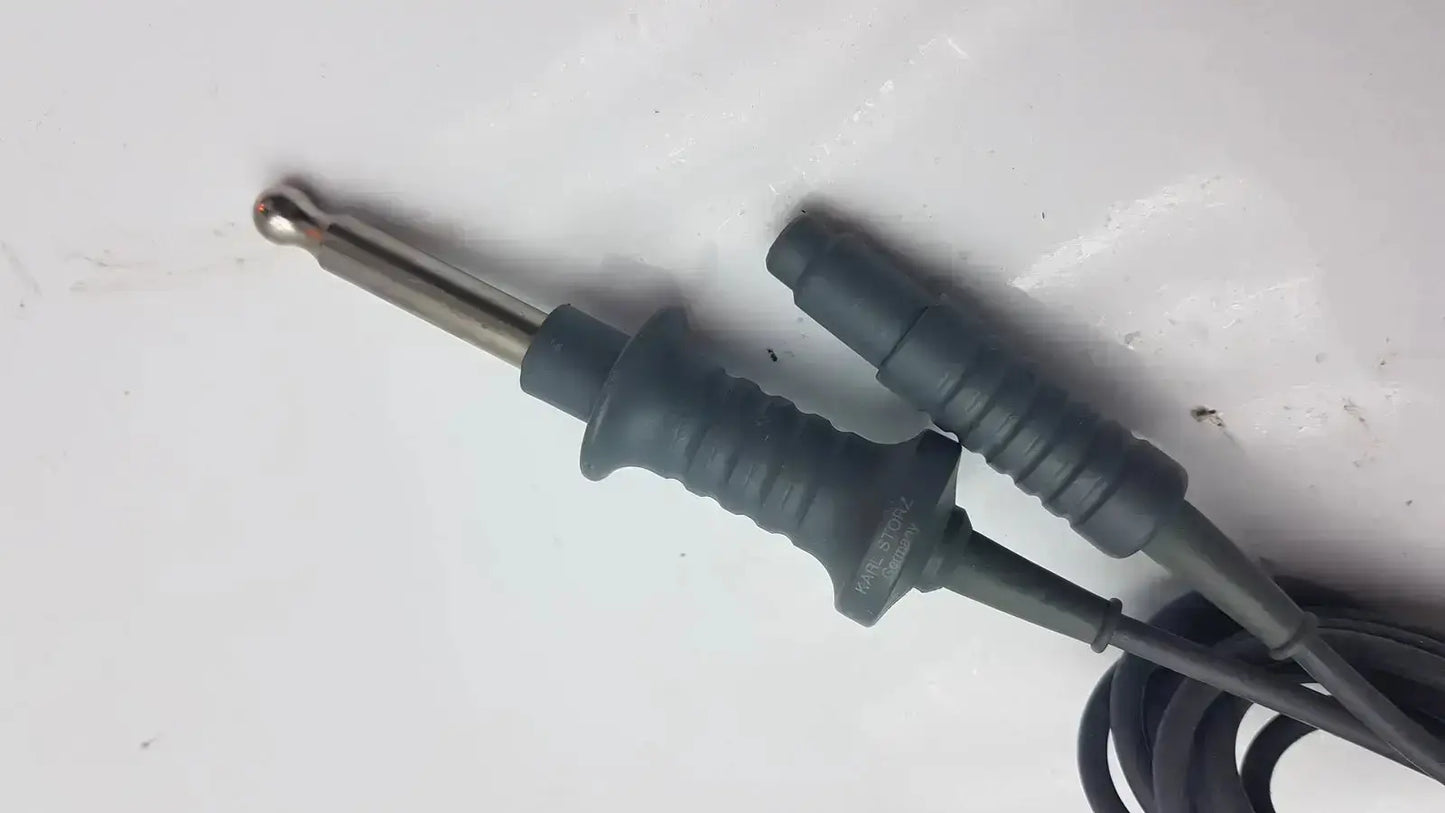 Black insulated test probe with metallic tip and textured grip for karl storz high-frequency unipolar cord use