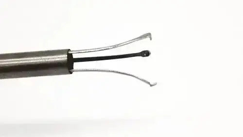 Metallic karl storz 27094p optical kidney stone grasper with sleek cylindrical handle and two fine curved wire loops