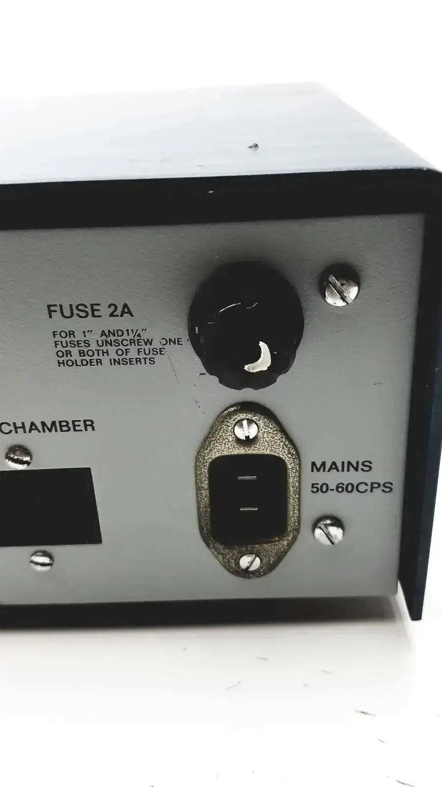Backside of silver metallic lkb cryokit control unit power supply with black plastic fuse and mains input ports