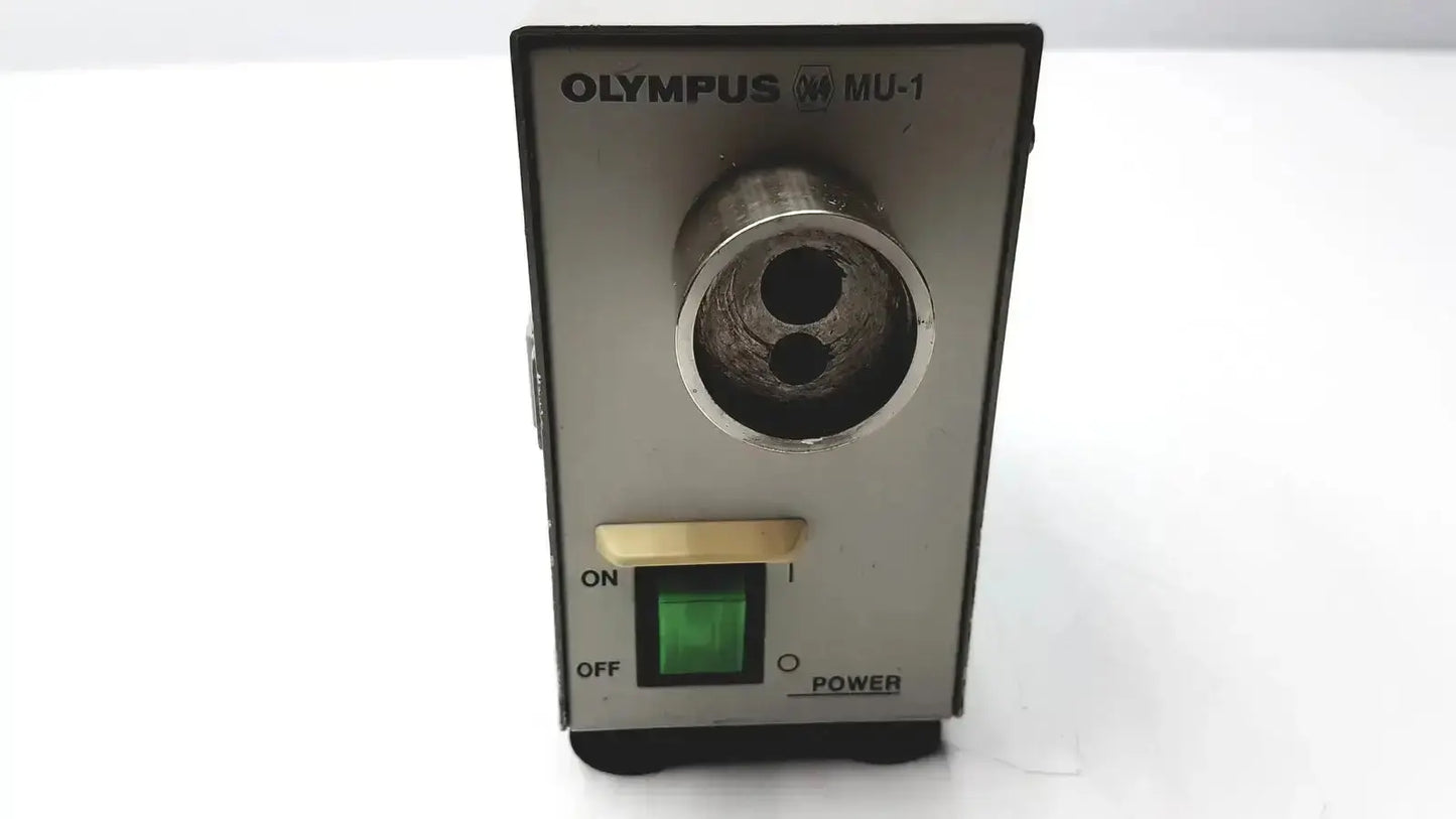 Olympus mu-1 endoscope maintenance unit with metallic cylindrical pencil sharpener hole and green power indicator light