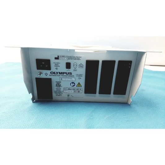 Silver olympus separation transformer with black ventilation slots and labeled specifications on its back panel.
