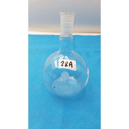Clear glass round-bottom flask with a narrow neck and threaded stopper, labeled ’28a’ on its side.