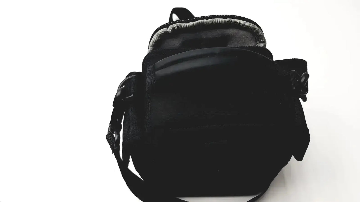 Black nylon crossbody bag with adjustable strap and zippered closure shown with panasonic model dmc-fz35 digital camera