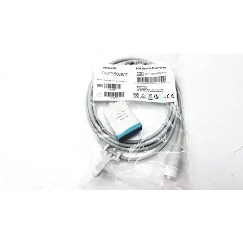 Gray coiled cable with a white and teal rectangular connector, packaged in clear plastic.