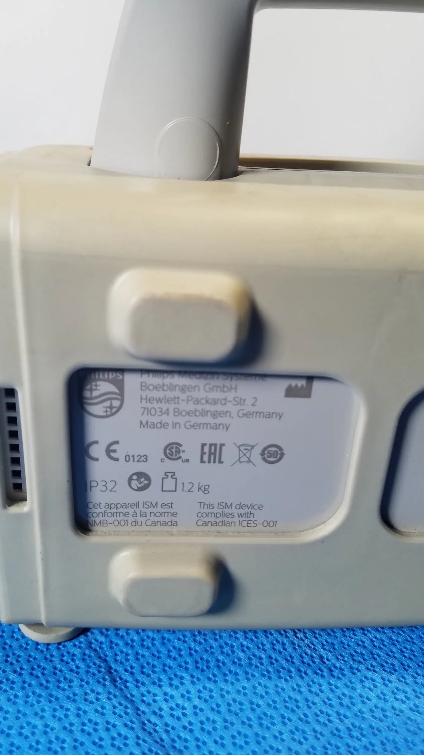 Beige philips intellivue mp2 portable patient monitor medical equipment with handle made in germany label visible