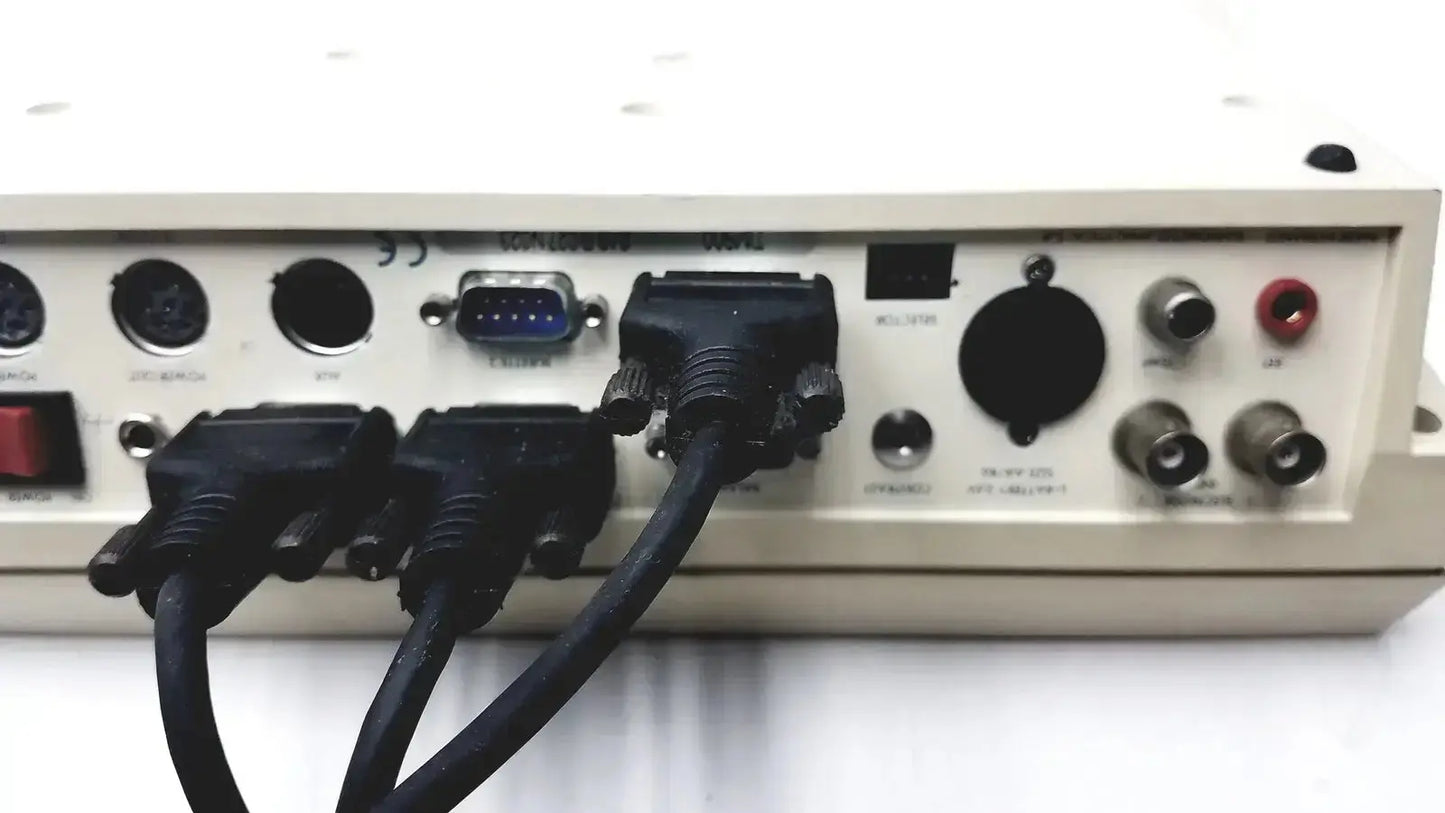 Beige radiometer copenhagen tim900 titration manager back side with multiple ports and connected black cables
