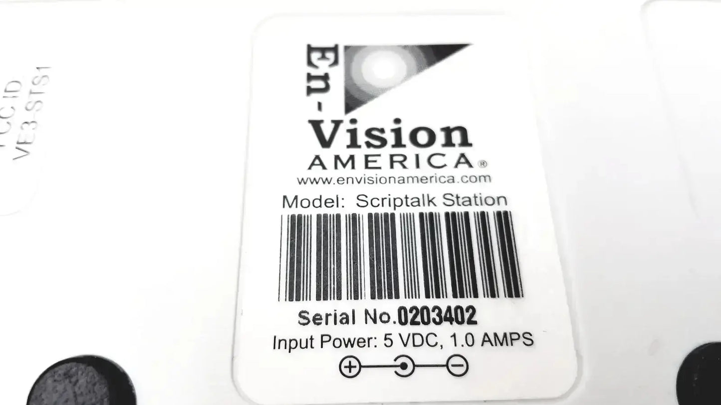White rectangular label with black text and logo on back of script talk station 0203402 prescription reading device