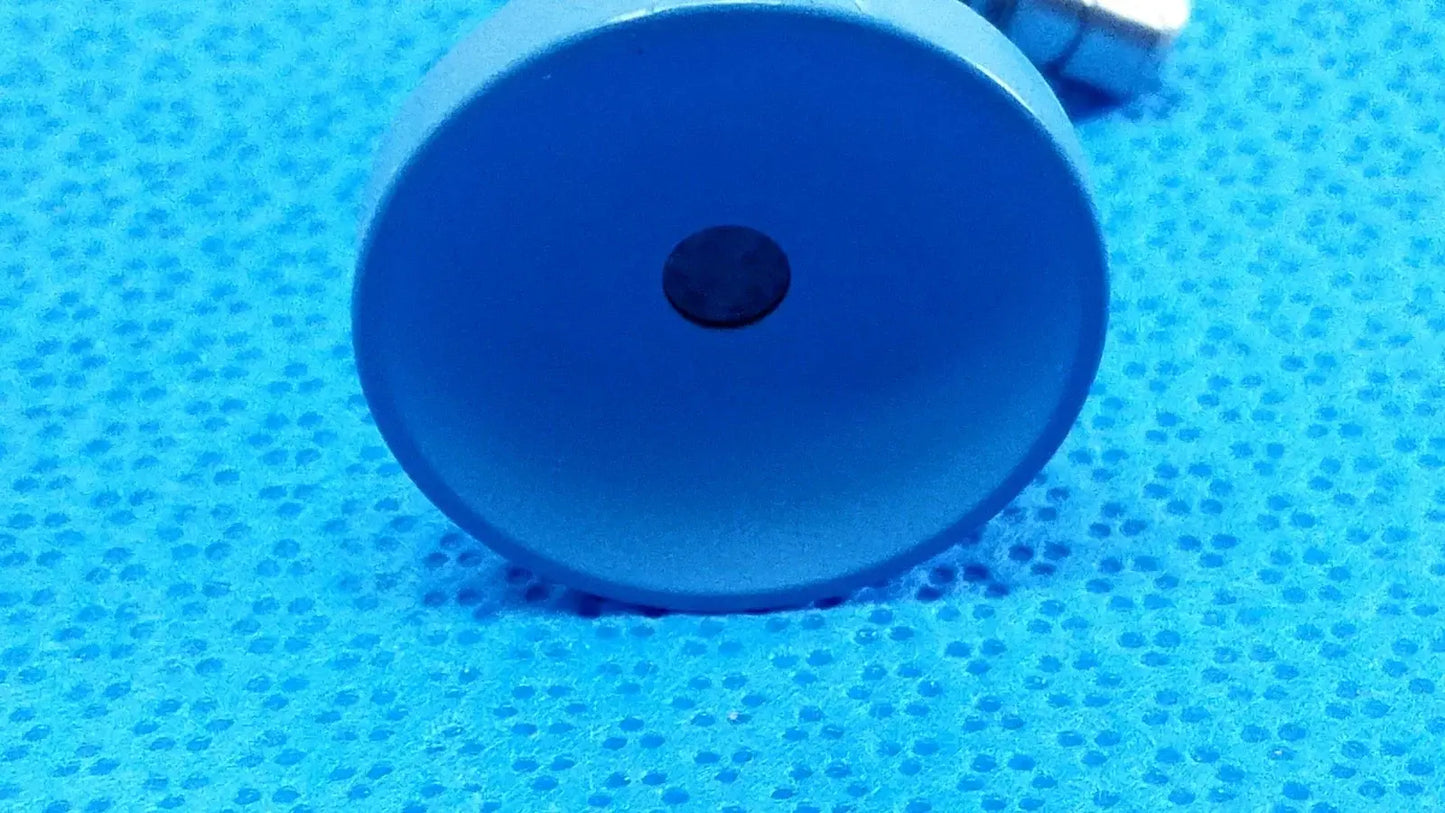 Blue circular magnetic base with central black magnet for reuse medical equipment in ideal eyes 5mm endoscope