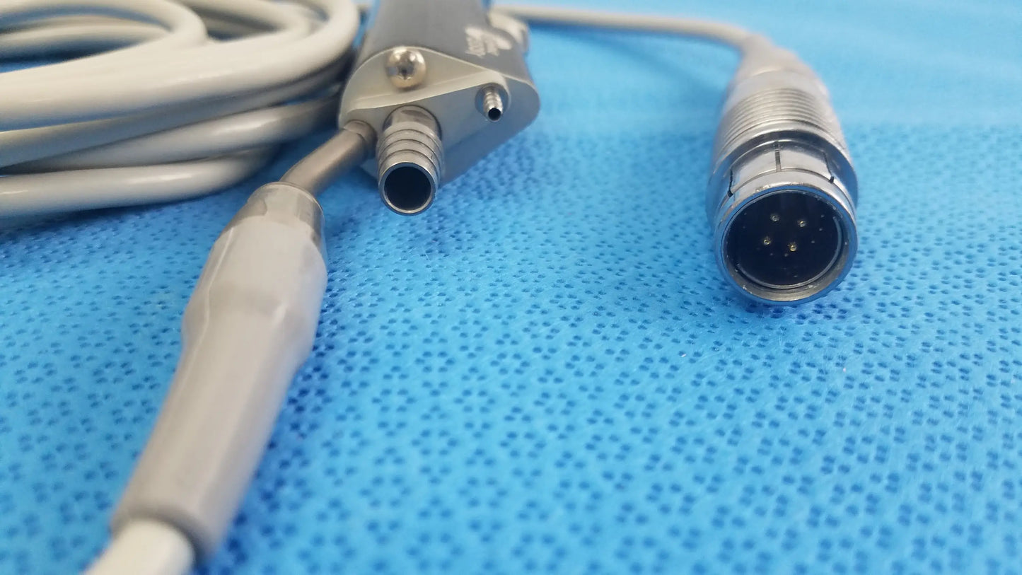Gray Stryker ESSx microdebrider handpiece with metallic connector and ribbed handle for reuse medical equipment
