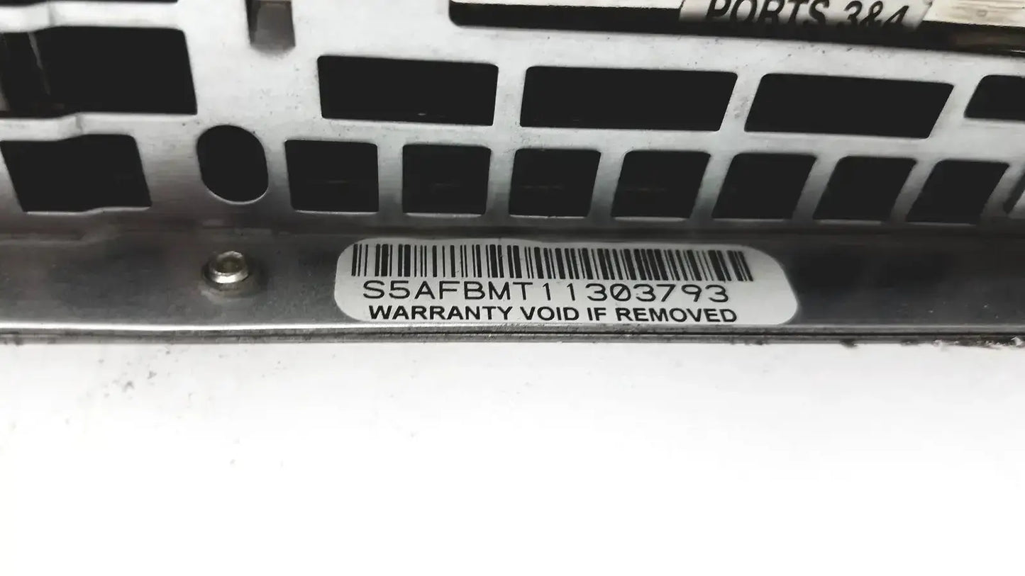 Silver metal server rack bracket with black cutouts and white serial label on the back of supermicro 5015b-mt super server