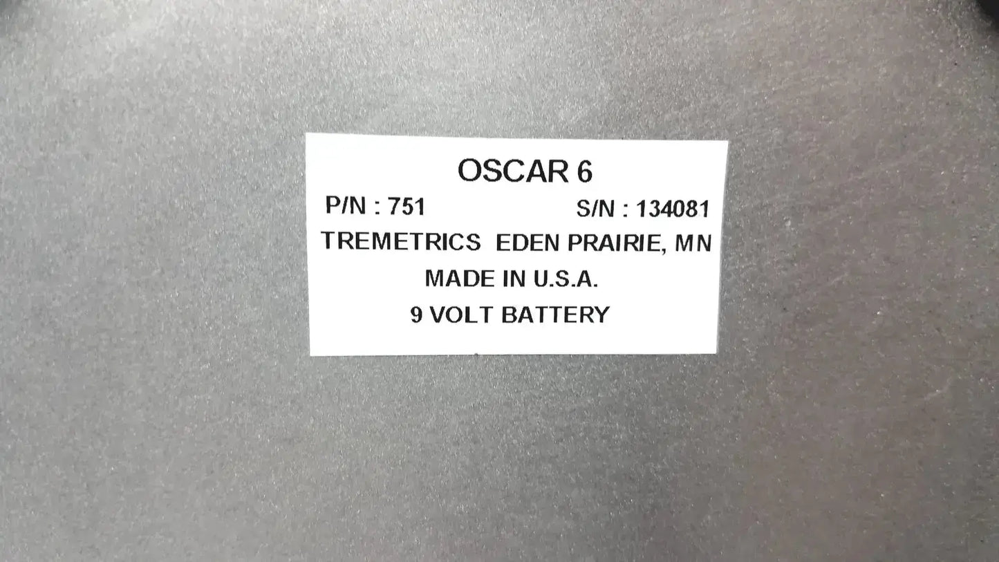 White label with black text oscar 6 affixed to gray metallic surface of tremetrics oscar electro-acoustic ear used medical equipment for sale