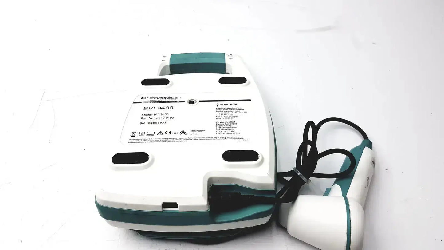 Teal and white black+decker electric toothbrush charger with attached brush for verathon bladderscan bvi 9400 ultrasound system