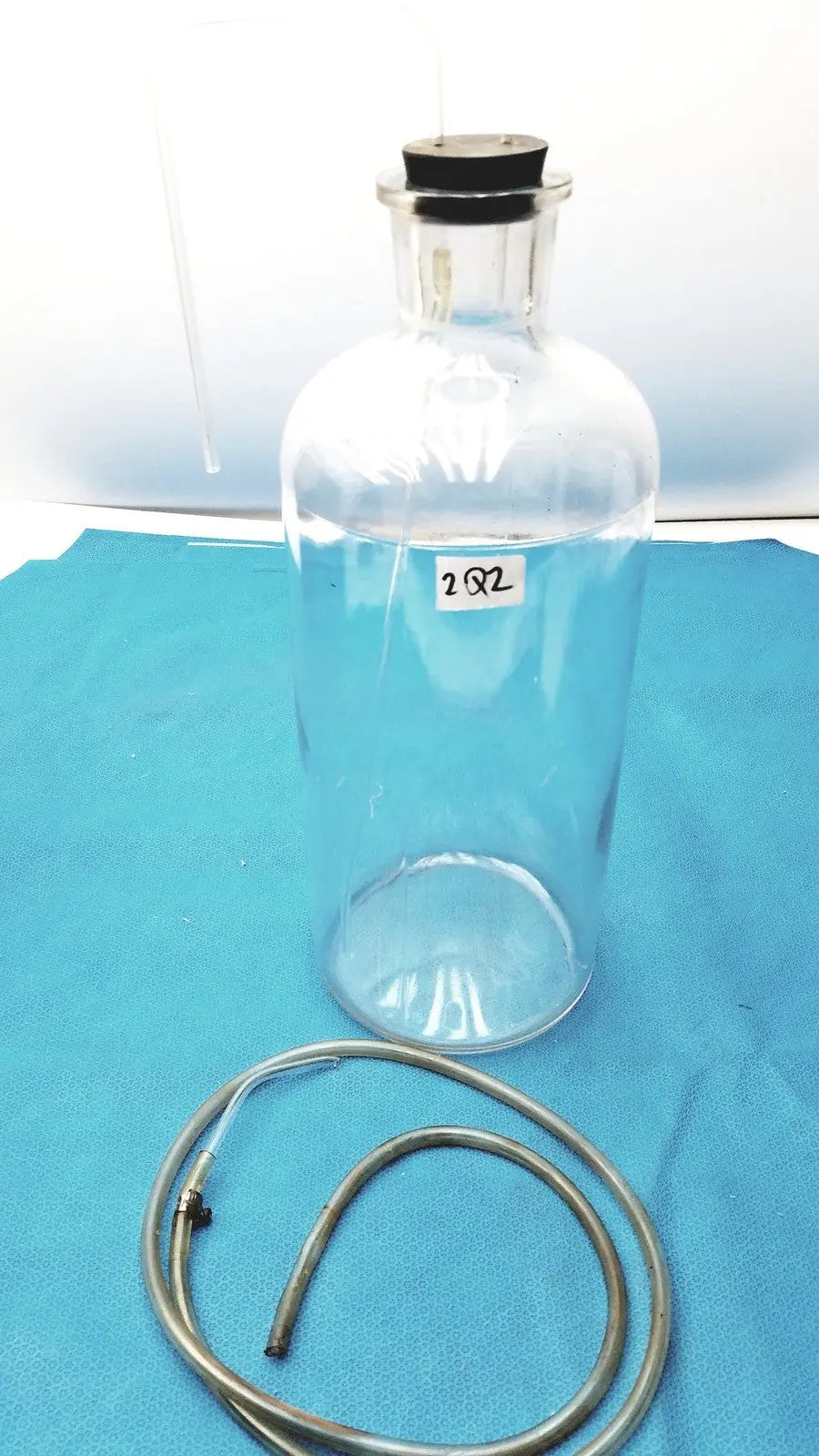 Vintage 9" Clear Glass Bottle with Embossed Base – Timeless Decorative Piece