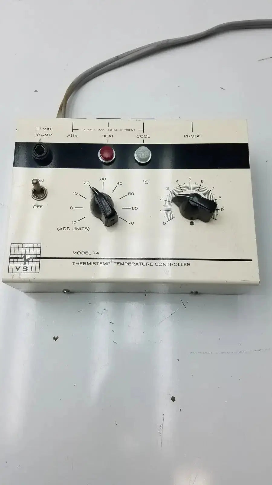 White vsi thermistemp temperature controller model 74 with black dials red silver buttons and gray power cord for -10-70°C use