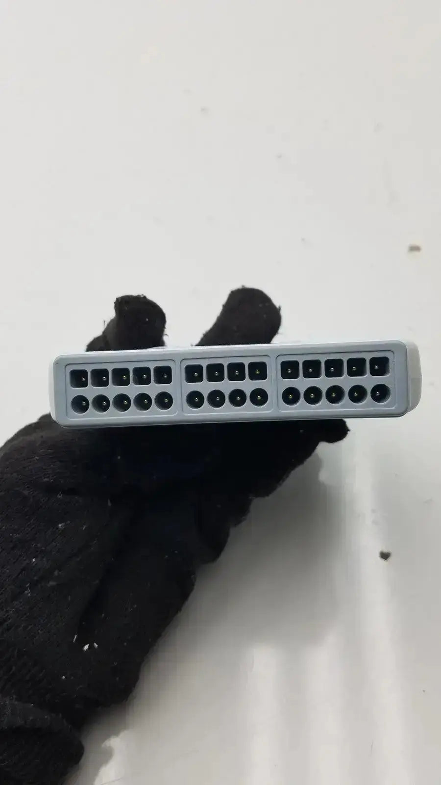 Gray plastic wireless ecg acquisition module by welch allyn with three rows of black network ports