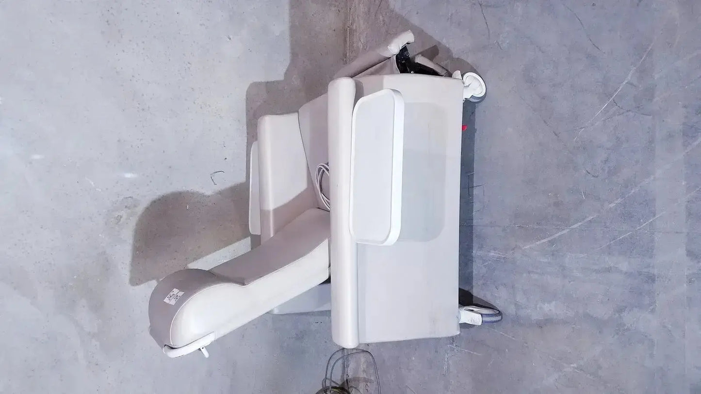 Beige winco 694 care recliner dialysis chair with adjustable armrests wheels side trays and vibrating back massager