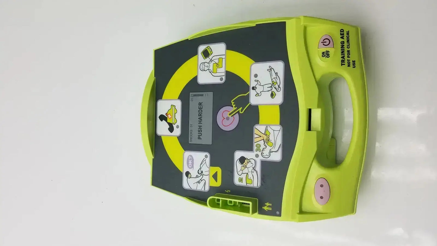 Lime green and black zoll aed plus trainer case with cartoon illustrations and pink face detail for aed plus trainer 2