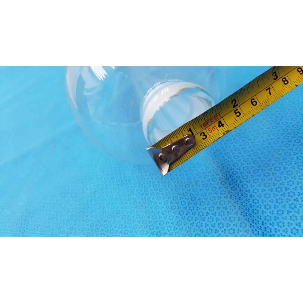 Clear plastic bottle with a metallic silver cap and measurement markings on its side.