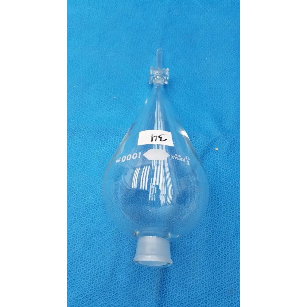 Clear glass graduated dropper bottle with a white label marked ’1000 ml’ and a narrow neck topped by a stopcock.