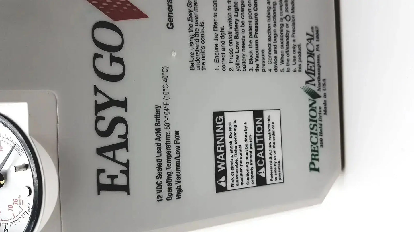 White plastic 2011 precision medical easy go vac aspirator back with black text and 12 vdc battery specs label