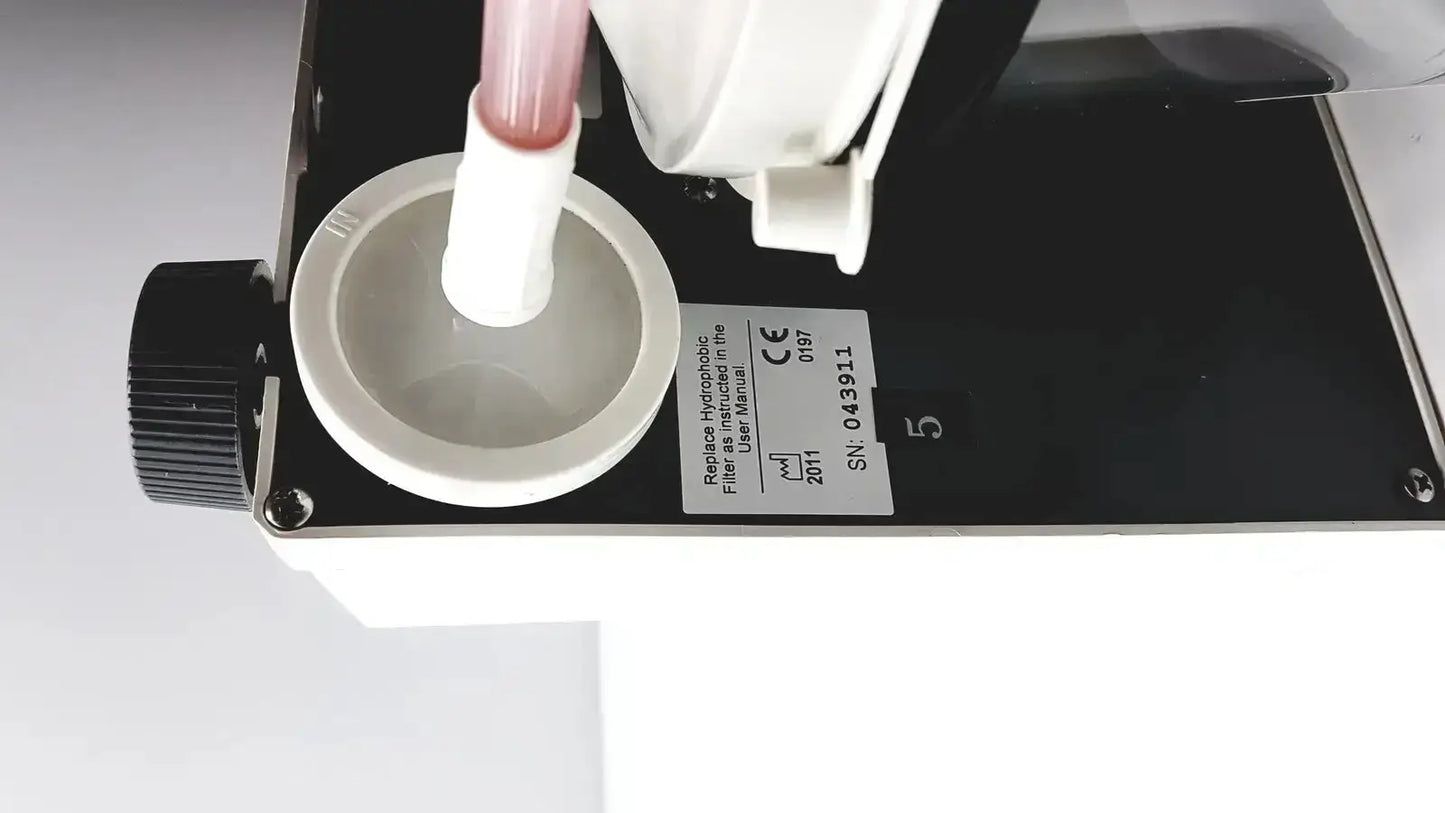 White plastic filter housing with black base labeled recluse hydrophobic filter for 2011 precision medical easy vac aspirator