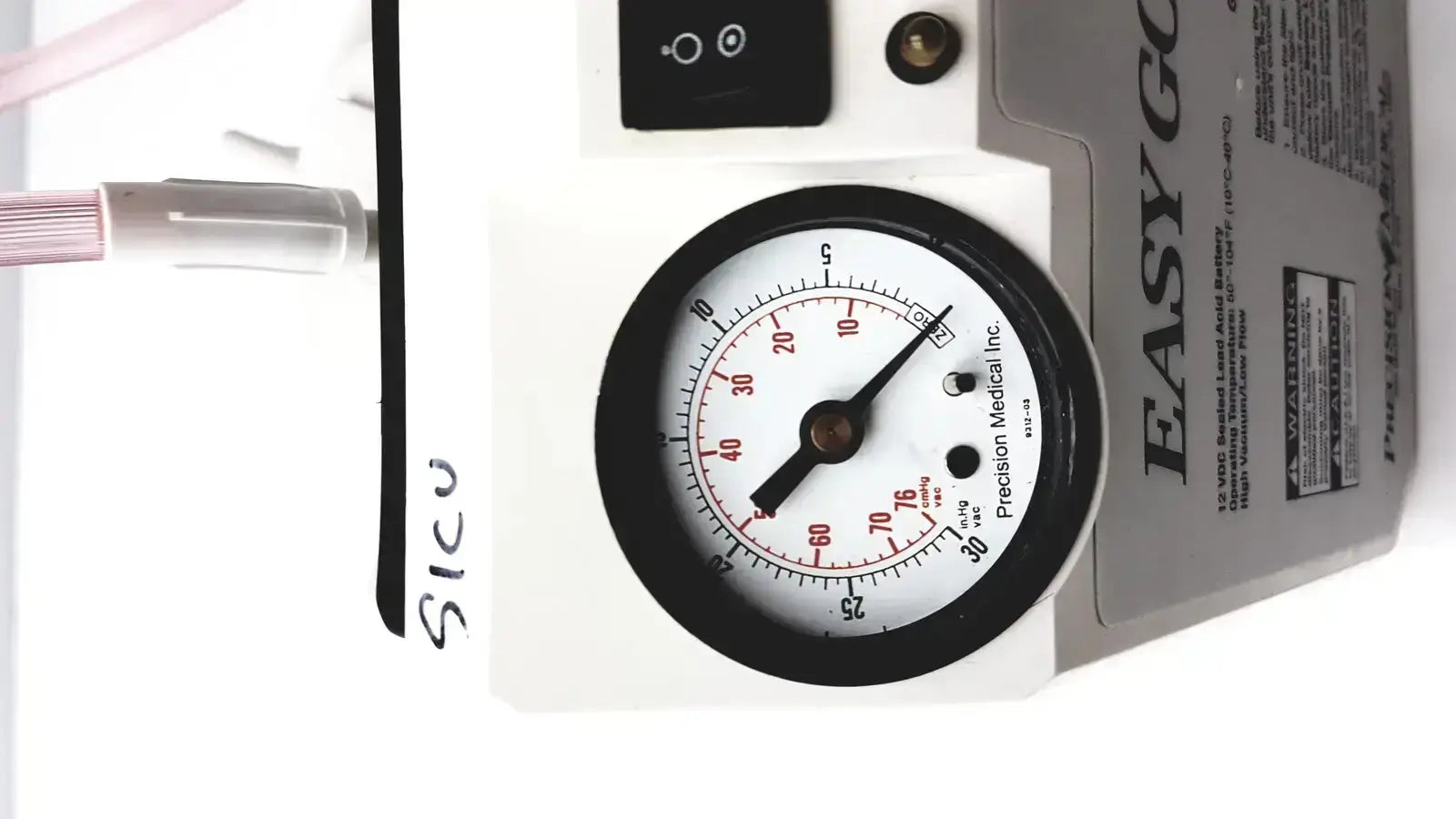 White and black pressure gauge with red markings labeled precision medical on the 2011 precision medical easy go vac aspirator