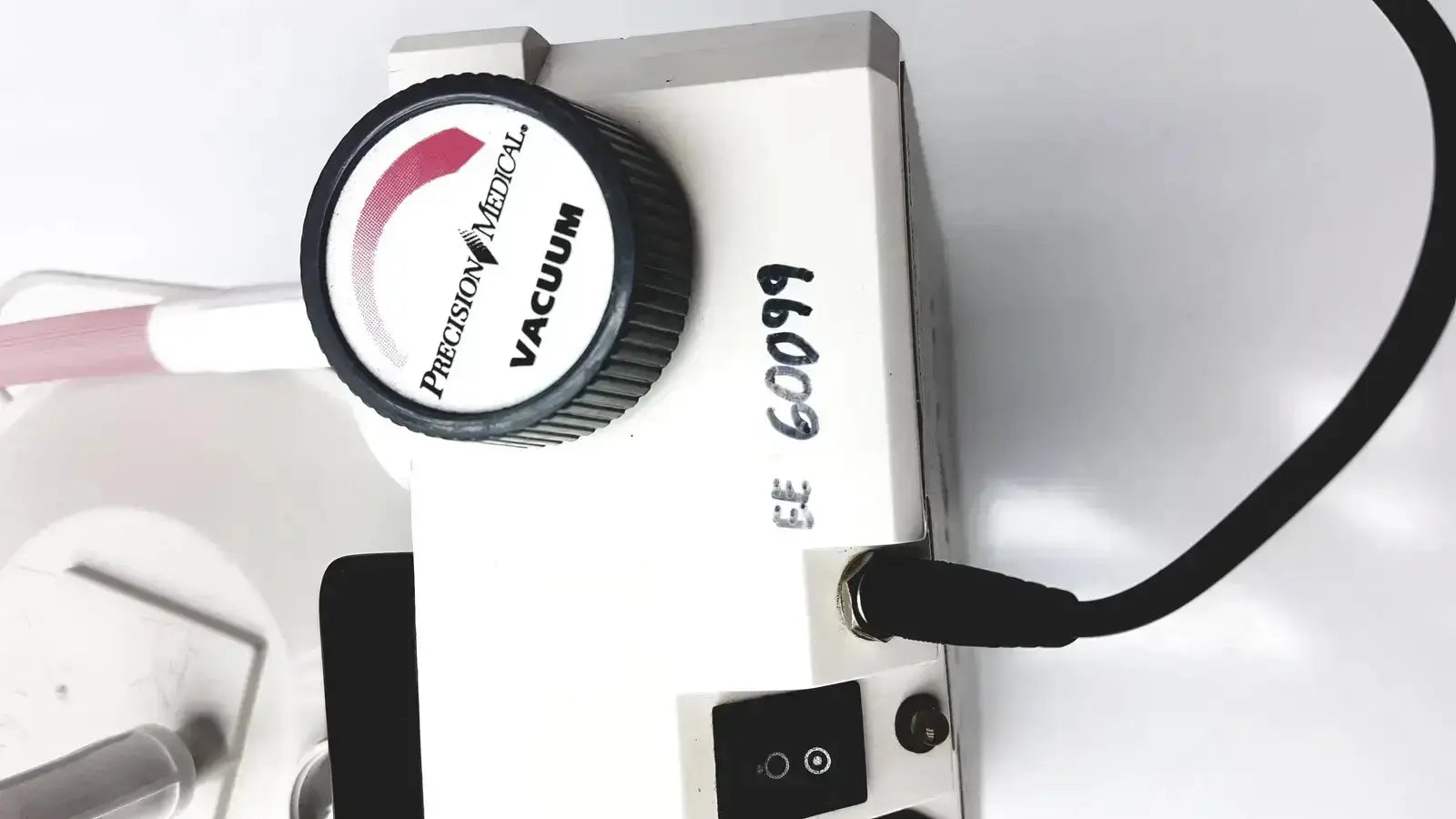 White precision medical easy go vac aspirator vacuum pump with black knob and labeled model number for medical use