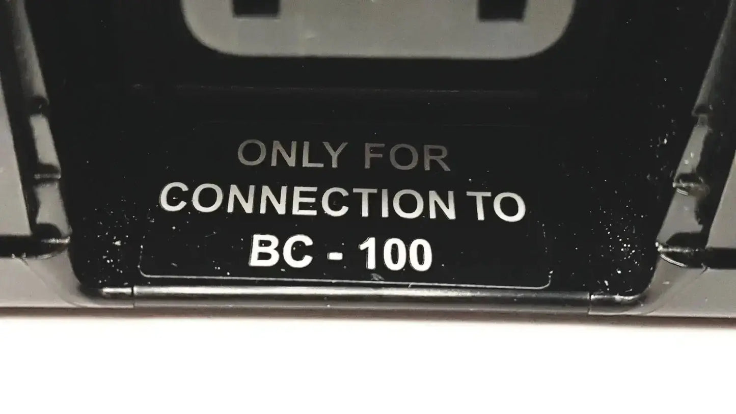 Black plastic label on the back of 3M bc-100 smart battery charger power base bc-210 for connection only
