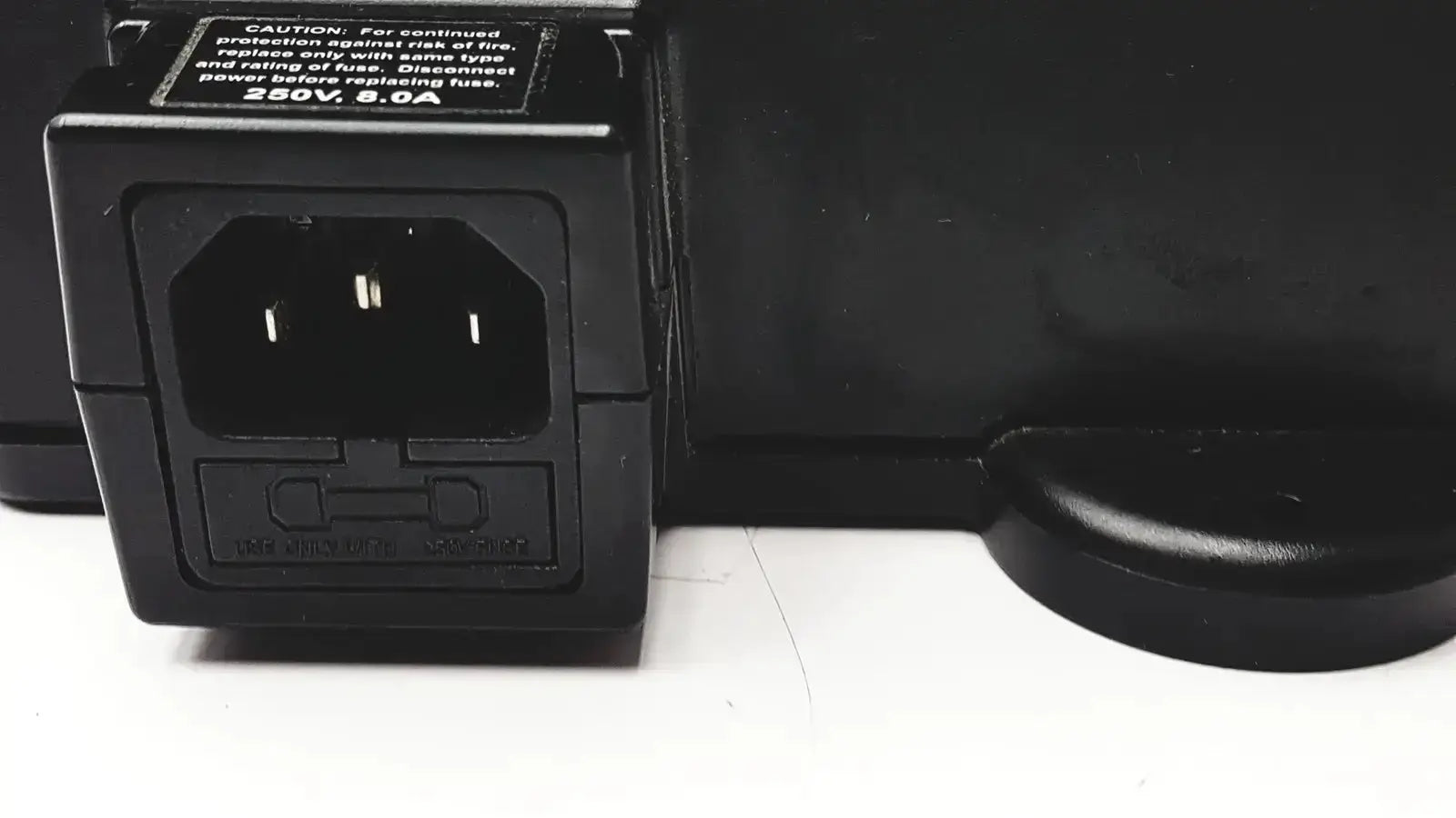 Black plastic 3m bc-100 smart battery charger power base bc-210 with rectangular input port and molded safety label back view