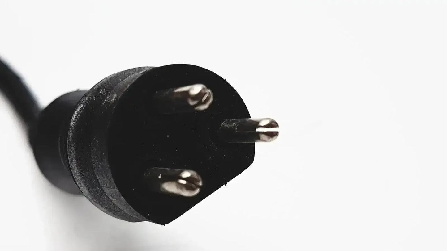 Black three-prong electrical plug with metallic contacts on the back of 3m bc-100 smart battery charger power base bc-210