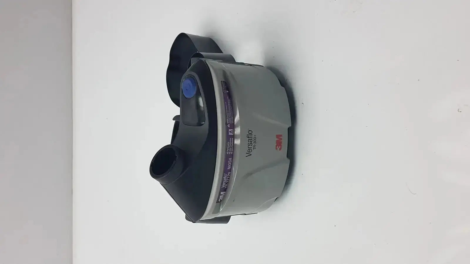 Gray and black 3m versafit respirator mask with blue button for versaflo tr-301n+ and tr-300n+ powered air purifier