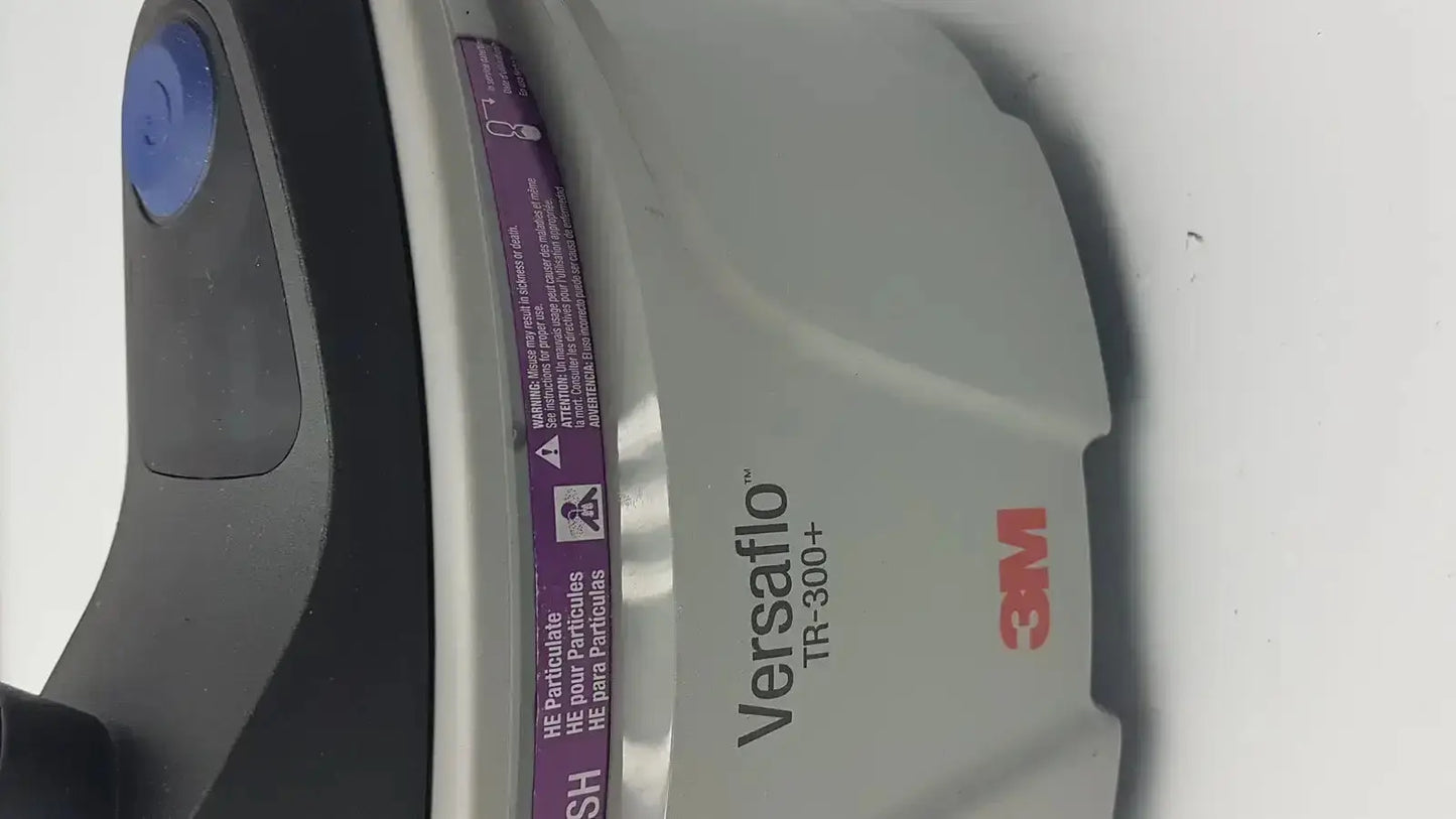 Gray and black 3m versaflo tr-300n+ versafoam respirator mask with blue button for tr-301n+ powered air purifier