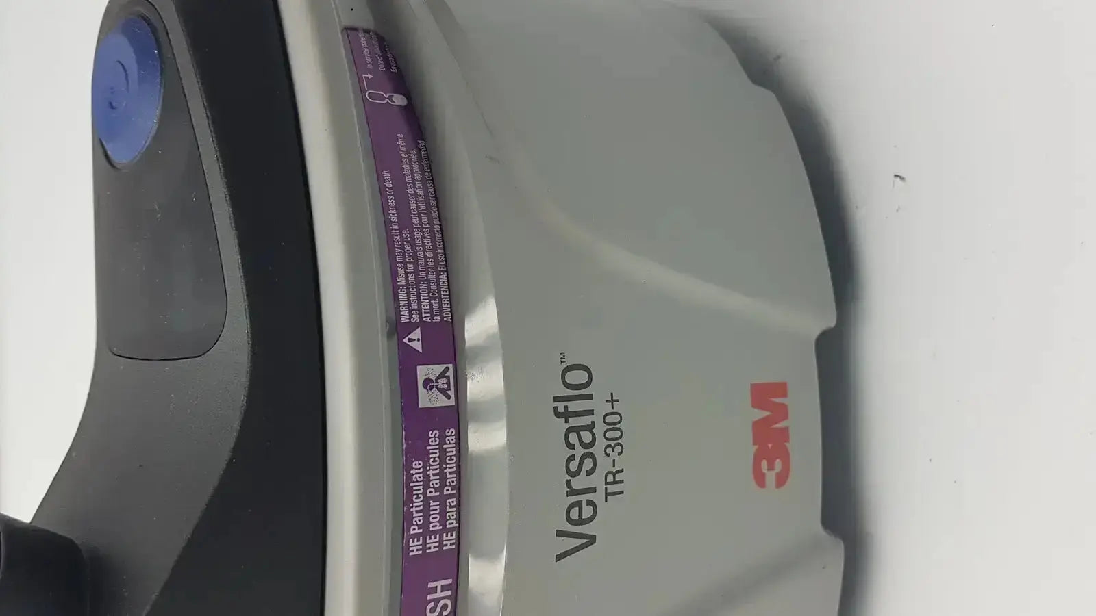 Gray and black 3m versaflo tr-300n+ versafoam respirator mask with blue button for tr-301n+ powered air purifier