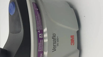 Gray and black 3m versaflo tr-300n+ versafoam respirator mask with blue button for tr-301n+ powered air purifier